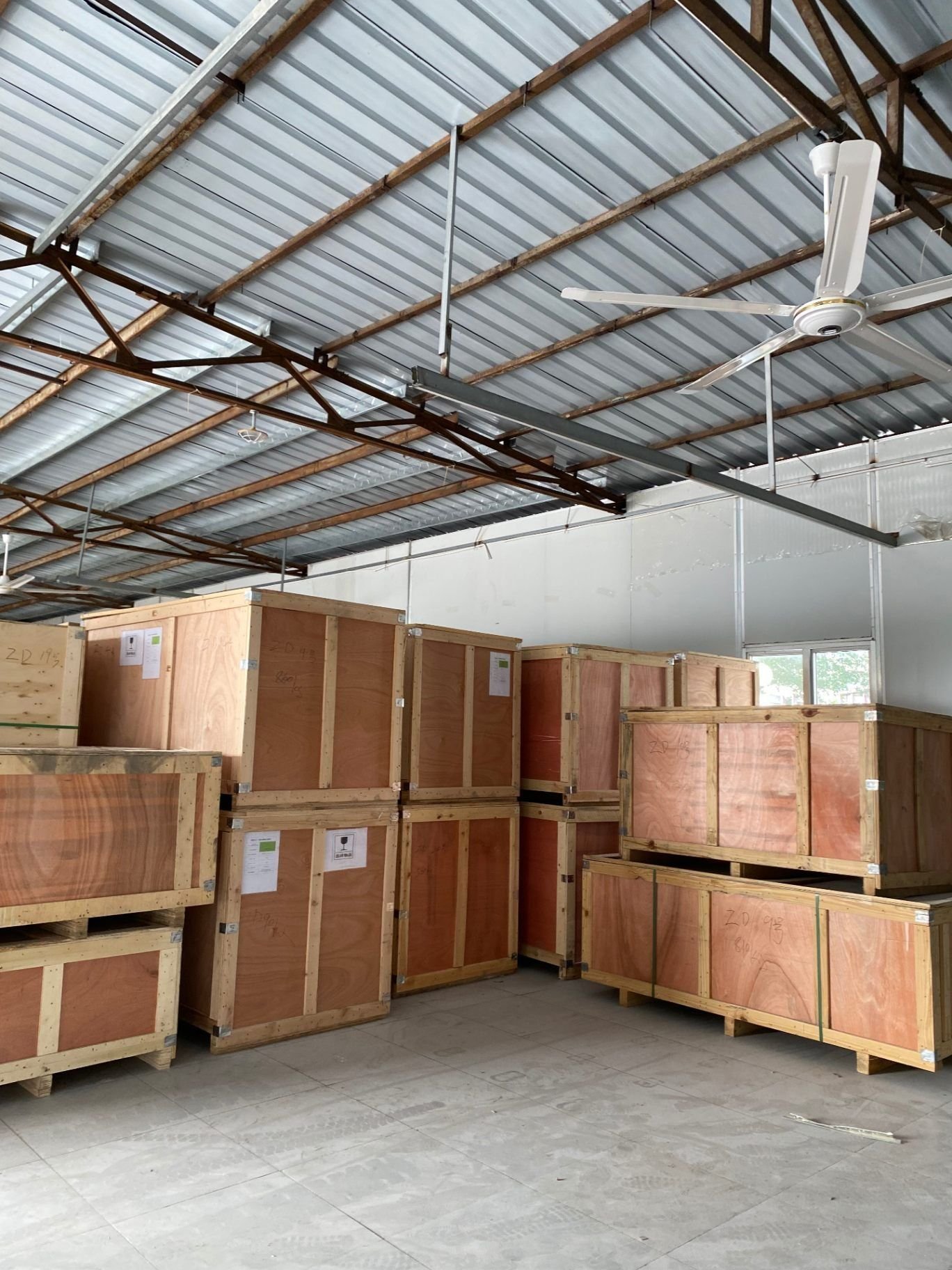 Crates staged by order number in the dispatch area
